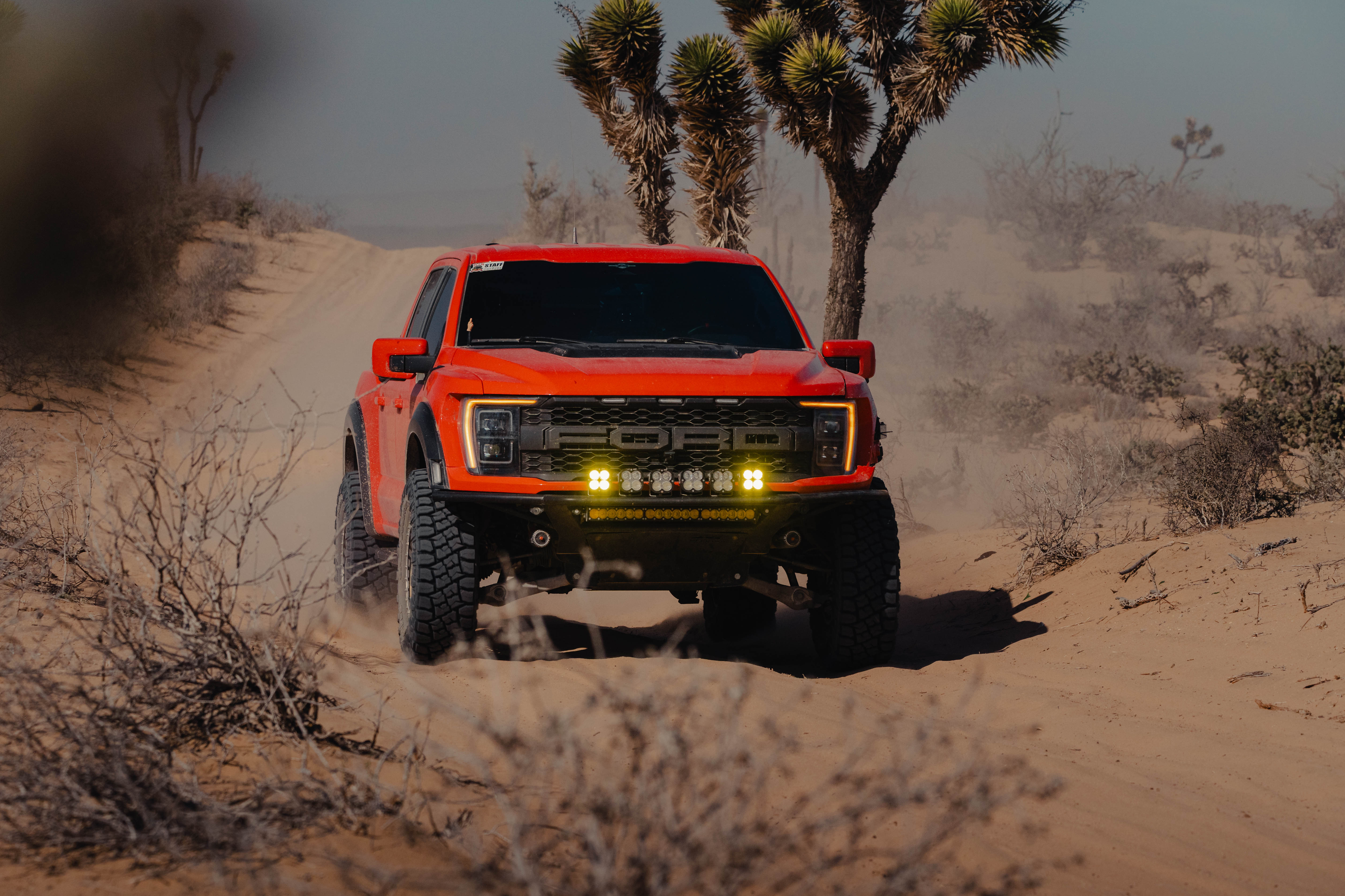 Ford Raptor driving through desert