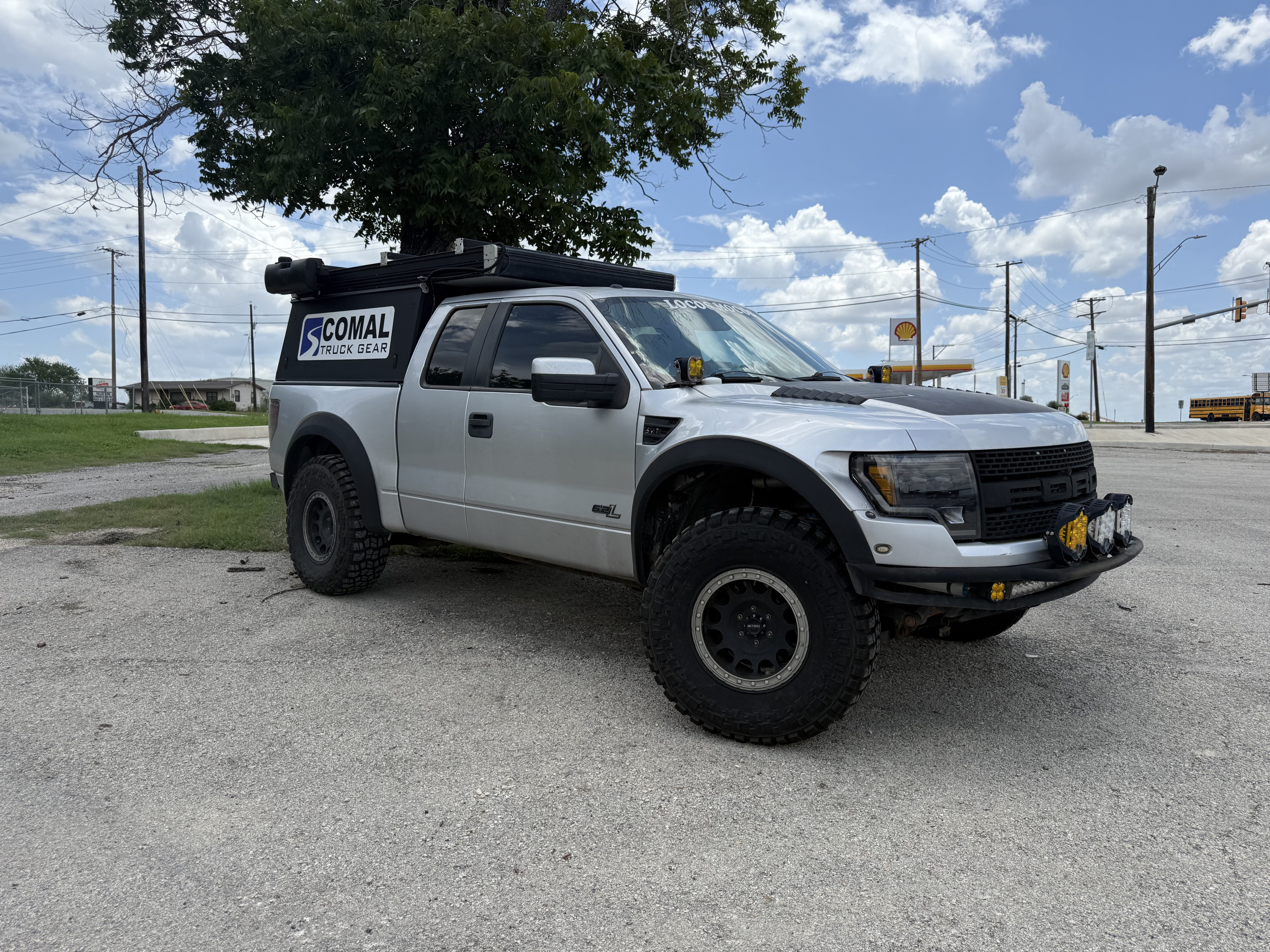 Comal Truck Gear shop truck — lifted white Ford SVT Raptor with CTG logo